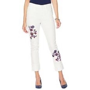 White jeans embellished by embroidery. Never worn.